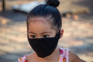 child wearing a big mask over entire face
