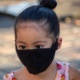 child wearing a big mask over entire face